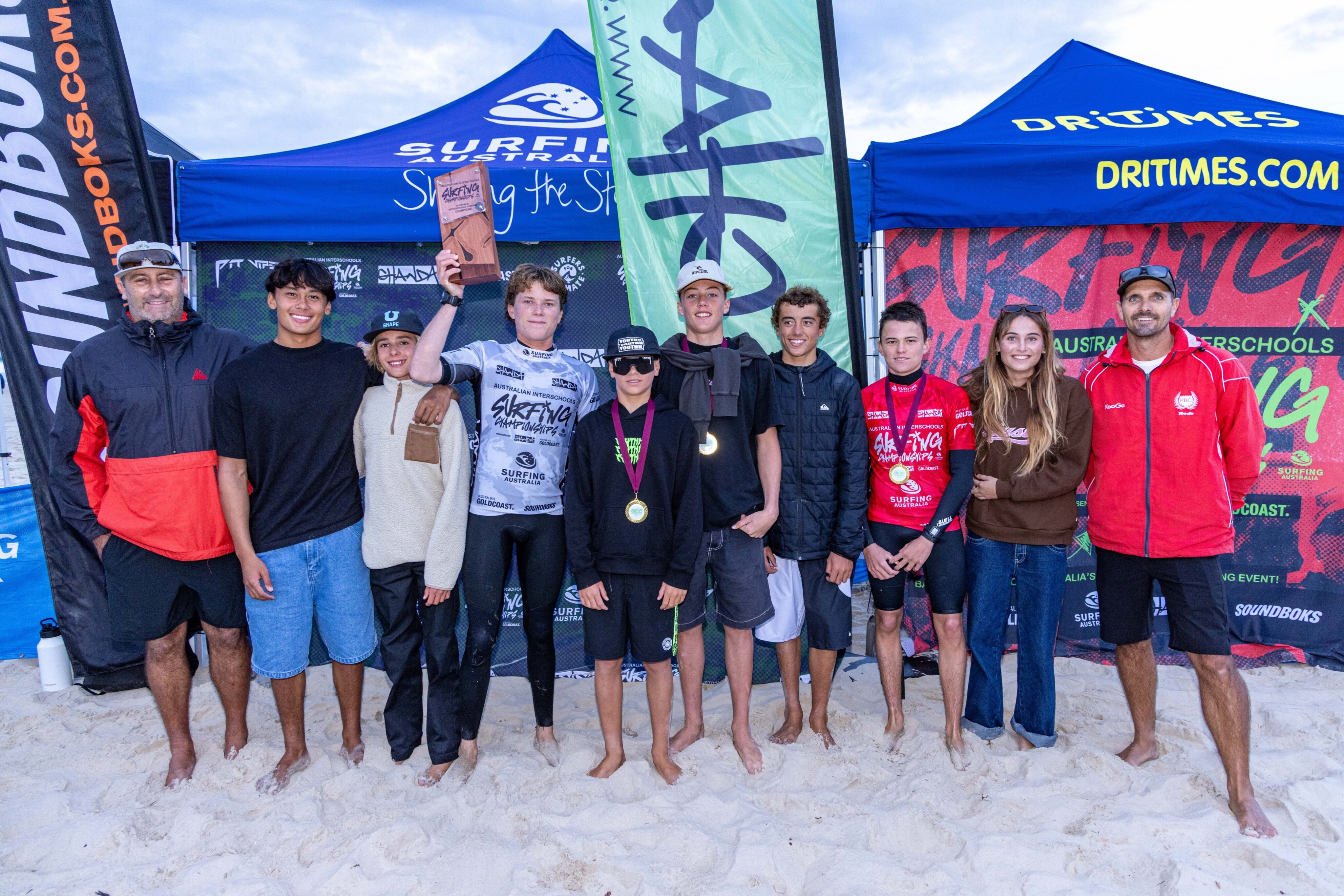 Palm Beach Currumbin with the Australian Interschools Surfing Championships Overall winners trophy at Miami this afternoon