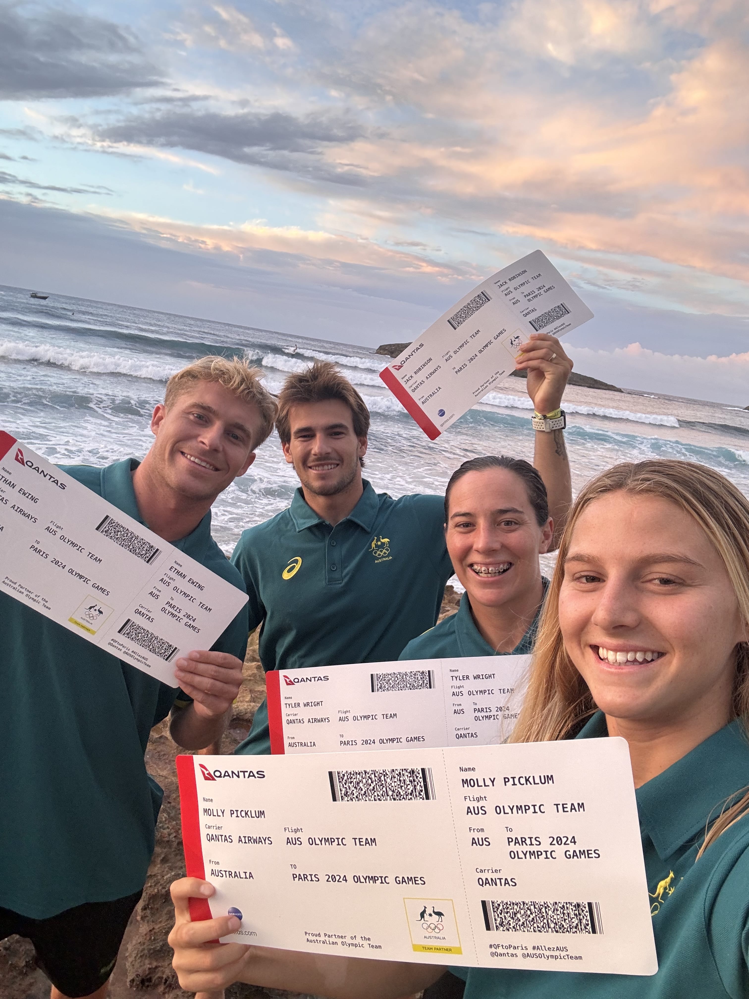 Ethan Ewing, Jack Robinson, Tyler Wright and Molly Picklum hold up their tickets to the 2024 Olympics in Paris where they will represent Australia