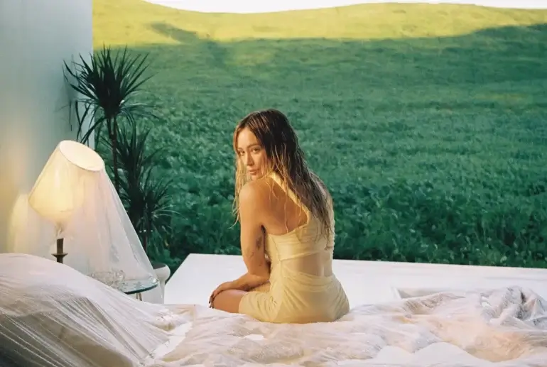 Hilary Duff drops 'Roommates,' co-written with husband Matthew Koma, featuring a music video directed by Billie Eilish collaborator Matty Peacock.