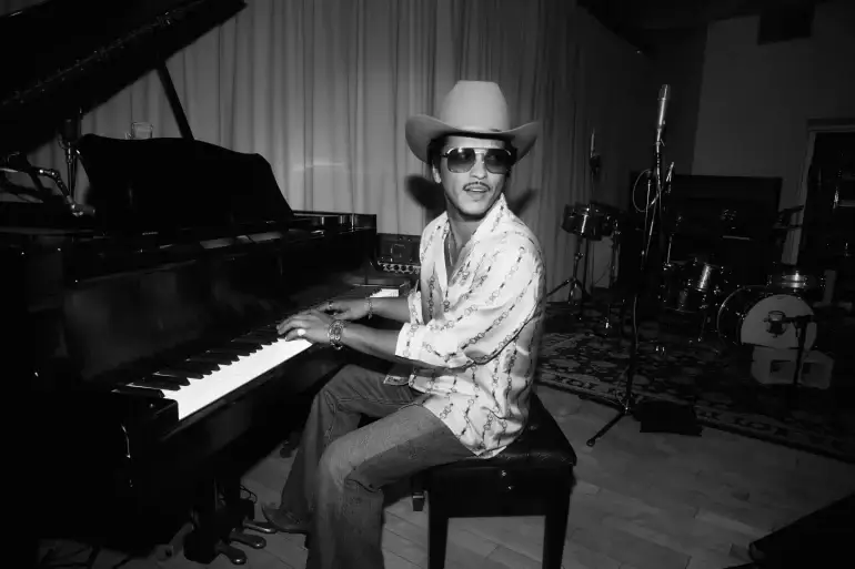 Bruno Mars is back with a new single, a music video, and a major stadium tour. Find out everything you need to know about the upcoming album, The Romantic.