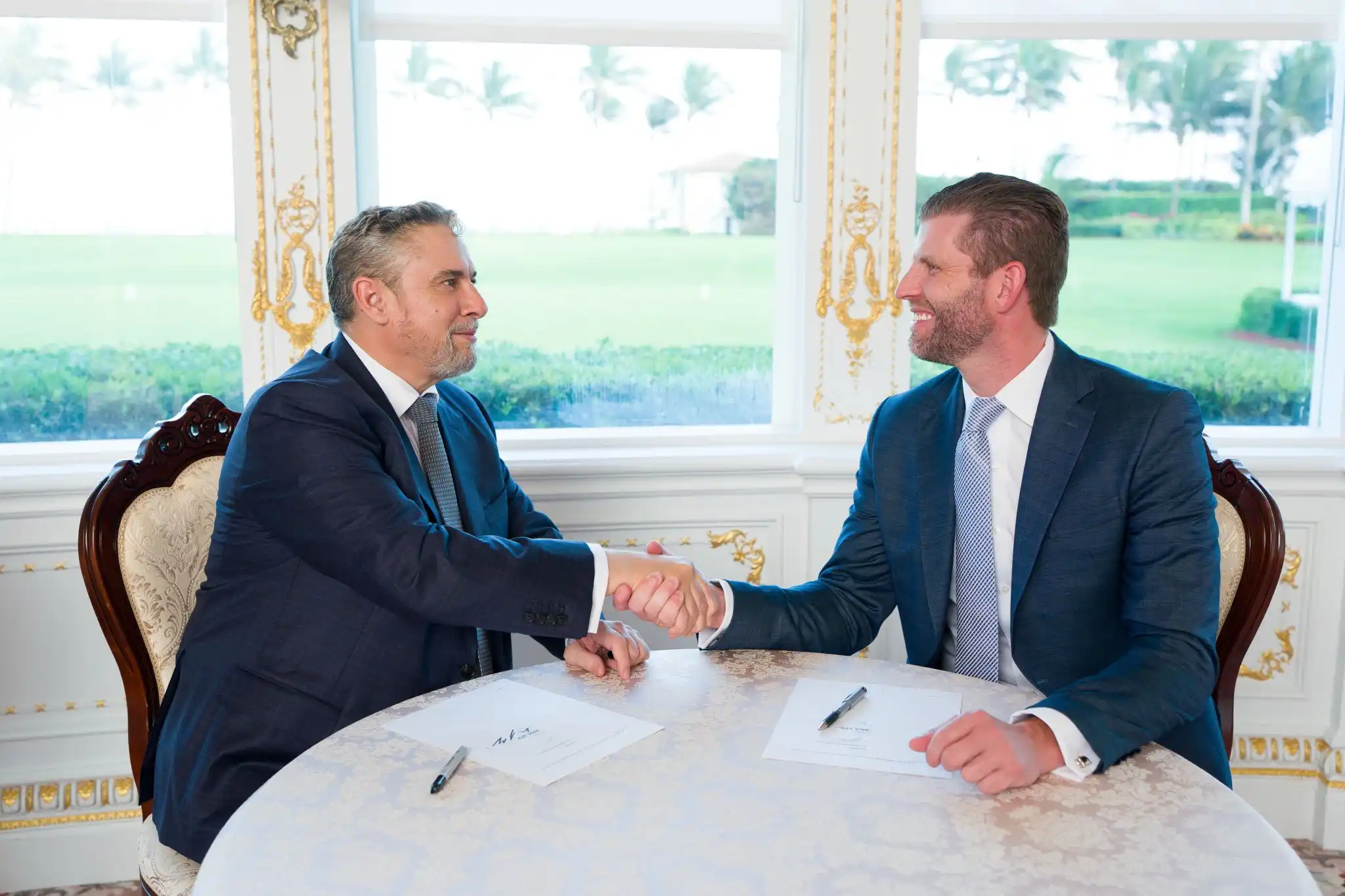 David Young of Altus Property meeting with Eric Trump, haking hands on the hotel management agreement and brand licensing agreement