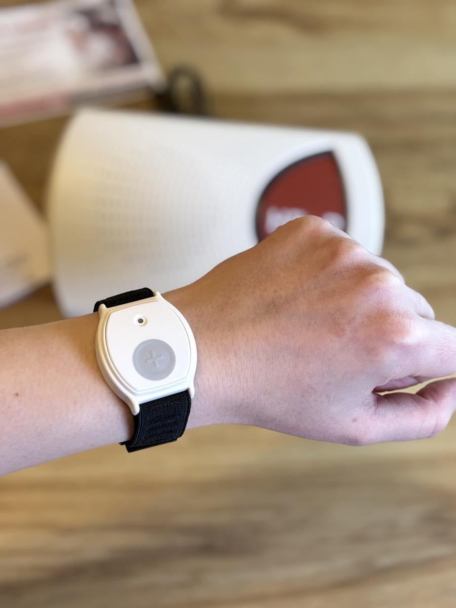 A medical alert wristband worn by an active senior