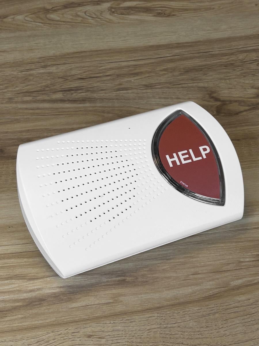 Alt text: A medical alert base unit in a Gold Coast home
